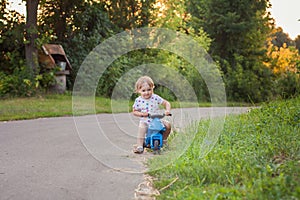 Kid rides bike