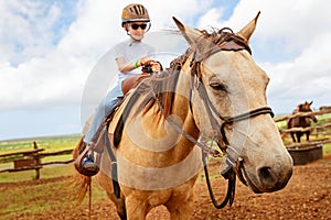 Kid riding a horse