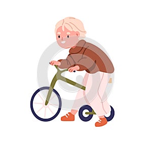 Kid riding tricycle. Cute little preschool boy on bicycle toy. Kindergarten nursery child, happy funny smiling toddler
