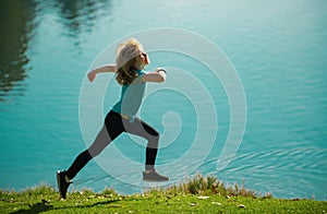 Kid runners in park. Little boy at athletics competition race. Young athlete in training. Runner exercising. Jogging for