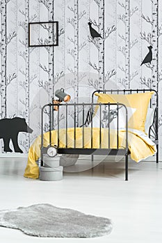 Kid`s bed with yellow overlay