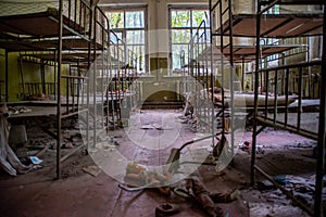 Kid`s bedroom in the kindergarten at the abandoned village Kopachi near Chernobyl