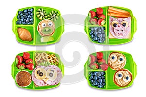 Kid`s healthy breakfasts with funny faces in a container on a white isolated background