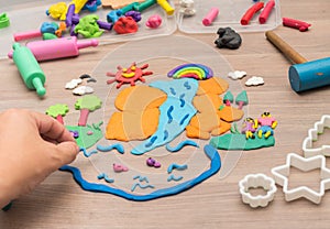 Kid`s playing and creating toys from play dough