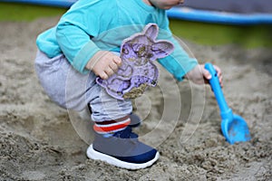 The kid in the sandbox.