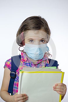 Kid school girl during pandemy going to school with mask