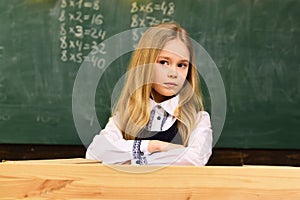 Kid at school room having education activity helped by teacher. Children need private coach to keep up with the class