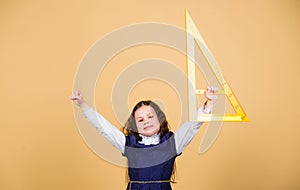 Kid school uniform hold ruler. School education concept. Learn mathematics. Theorems and axioms. Smart and clever photo