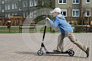 Kid and scooter photo