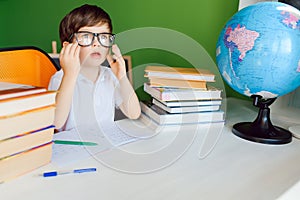 Kid in Self isolation doing his mathematics homework while school off,Child learning math at home during covid lock down,Home