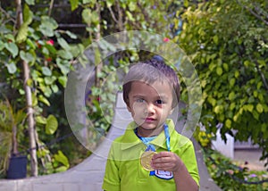 Kid showing medal