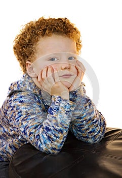 Kid sitting with head in his hands