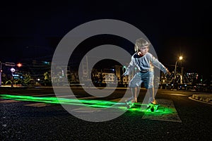 Kid skating in a night park