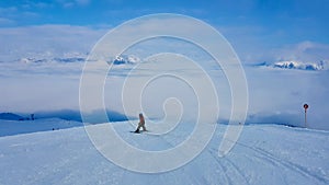 Kid skiing on empty slopes on beautiful winter day. Montafon, Austria.