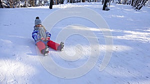 Kid Sledding in Snow, Child Playing in Winter, Girl Sledging in Park, Children Sleighing on Slope