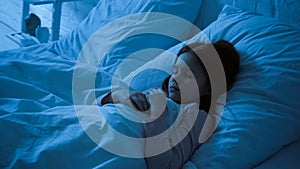 Kid sleeping on bed with white