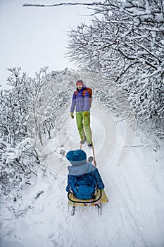 Kid on the sleigh.