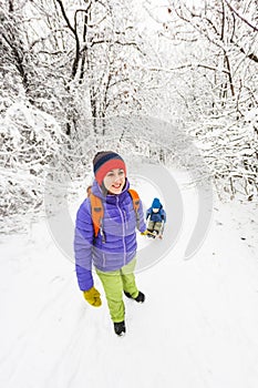 Kid on the sleigh.