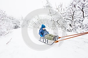 Kid on the sleigh.