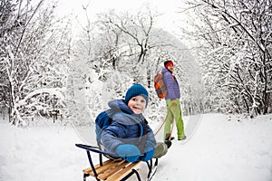 Kid on the sleigh.