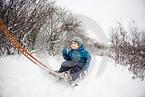 Kid on the sleigh