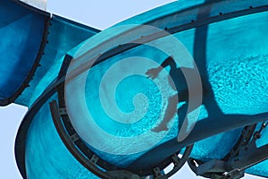 Kid sliding a blue Waterslide photo