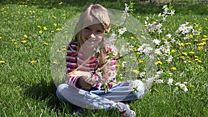 Kid by Spring Blossom Tree in Park, Child Laughing Smiling by Flowers, Happy Young Girl Portrait Laughs Outdoor in Nature