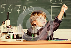 Kid study biology chemistry. Boy microscope and test tubes school. Basic knowledge primary school education. Educational