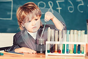 Kid study chemistry. Biotechnology and pharmacy. Genius pupil. Education concept. Experimenting with chemistry. Talented