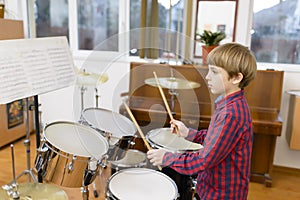 Kid Studying Drums photo