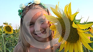 Kid in Sunflower Agriculture Field, Child Playing in Agrarian Harvest, Farmer Girl Plays in Prairie, Children Outdoor in Nature