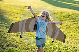 Kid superhero with jetpack. Child pilot play on summer day. Excited child playing outdoors. Success, leader and winner