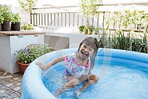 Kid swim in inftable pool