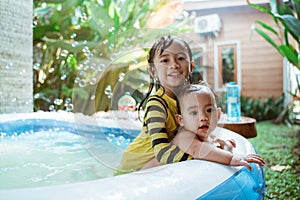 Kid swim in inftable pool