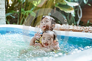 Kid swim in inftable pool