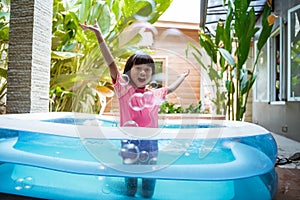 Kid swim in inftable pool