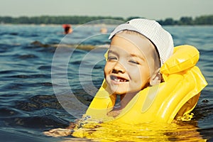 Kid with swiming vest weared