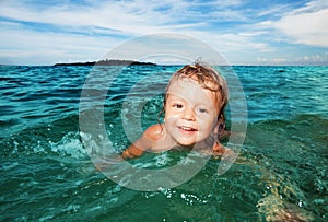 Kid swimming in the sea