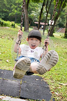 Kid on swing