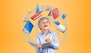 Kid takings note with books flying on colored background, learning and knowledge