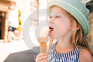 Kid tasting icecream photo
