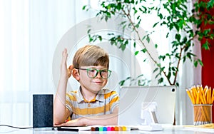 Kid and technology. Boy in shirt is reading tablet computer. Modern education and school technology concept with laptop