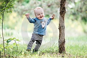 Kid toddler in park, happy expression