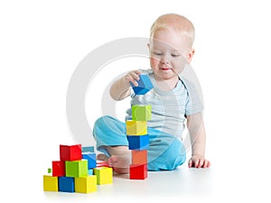 Kid toddler playing with building block toys