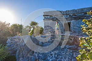 Kid on the top of antique ruins