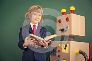 Kid with toy robot in school