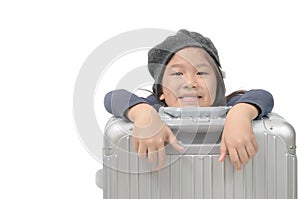 Kid traveler with big luggage isolated