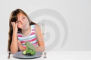 Kid unhappy with her vegetables