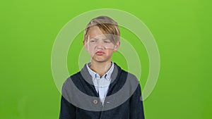 Kid is upset and sad. Green screen