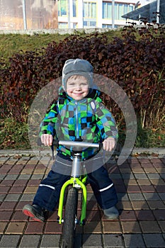 Kid using balance bike photo